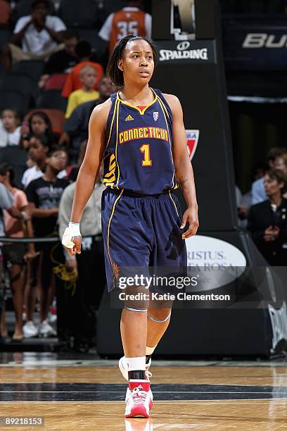 Amber Holt of the Connecticut Sun walks up court during the game against the San Antonio Silver Stars on July 17, 2009 at the AT&T Center in San...