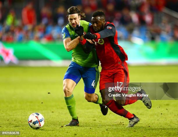 Jozy Altidore of Toronto FC battles with Gustav Svensson of the Seattle Sounders for the ball during the first half of the 2017 MLS Cup Final at BMO...