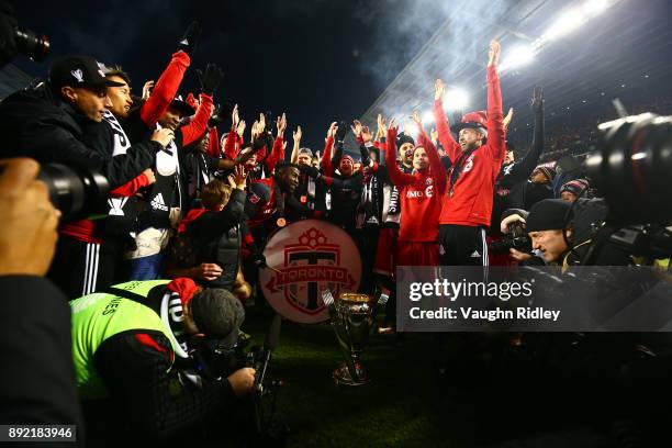 Jozy Altidore of Toronto FC plays a drum with teammates after winning the 2017 MLS Cup Final against the Seattle Sounders at BMO Field on December 9,...