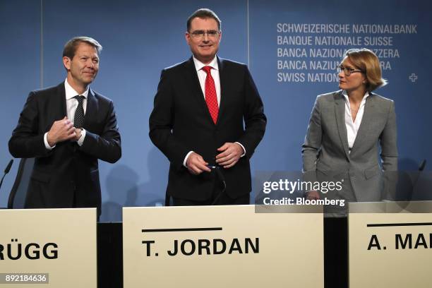 Fritz Zurbruegg, vice president of the Swiss National Bank , left, Thomas Jordan, president of the Swiss National , center, and Andrea Maechler,...