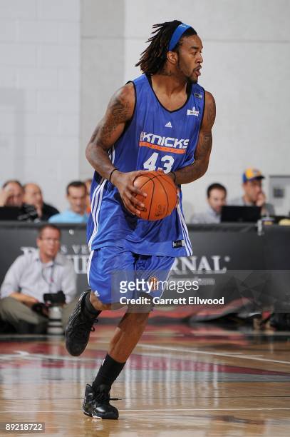 Jordan Hill of the New York Knicks drives the ball up court during the game against the Memphis Grizzlies during the NBA Summer League presented by...