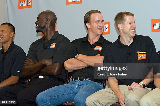 Gold medal winning decathlete Bryan Clay, NBA star Kevin Garnett, Indianapolis Colts quarterback Peyton Manning, and triathlete Hunter Kemper laugh...