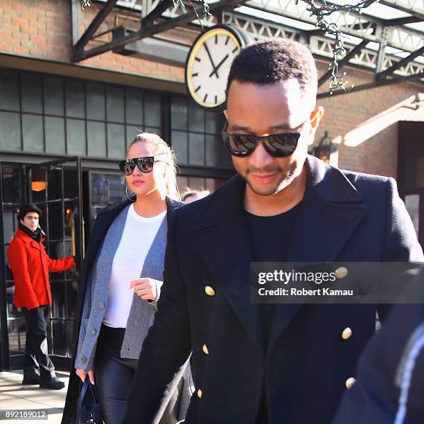 John Legend, wife Chrissy Teigen and their daughter Luna seen out and about in Manhatttan on December 13, 2017 in New York City.