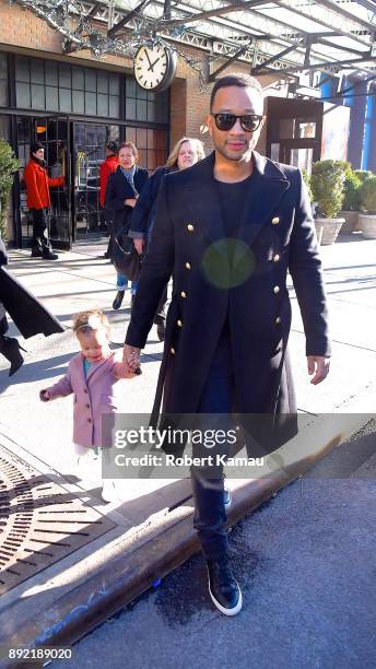 John Legend, wife Chrissy Teigen and their daughter Luna seen out and about in Manhatttan on December 13, 2017 in New York City.