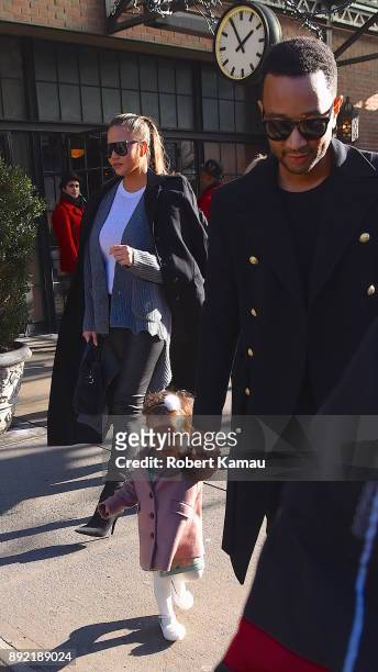 John Legend, wife Chrissy Teigen and their daughter Luna seen out and about in Manhatttan on December 13, 2017 in New York City.