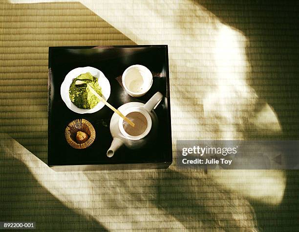 powdered green tea, tea pot and cup set up on tray for tea ceremony - ceremony stockfoto's en -beelden