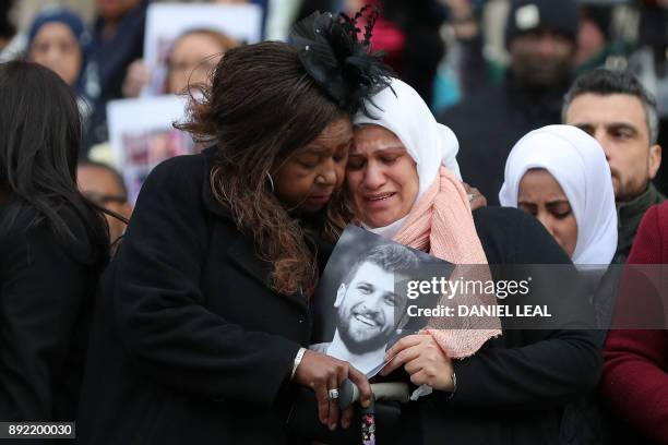Mourners leave after attending the Grenfell Tower National Memorial Service at St Paul's Cathedral in London on December 14 to mark the six month...