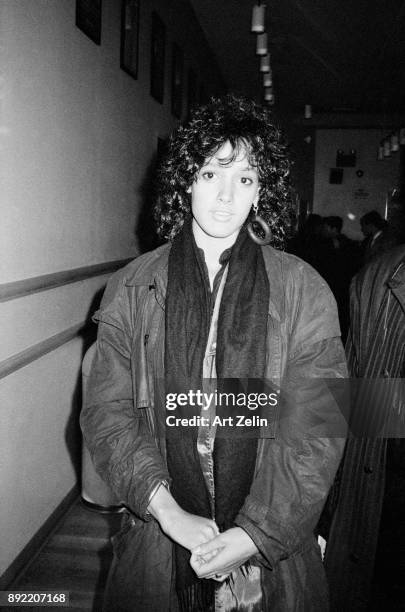 Actress Jennifer Beals poses for a quick snapshot in a coat and scarf, New York City, 1980.