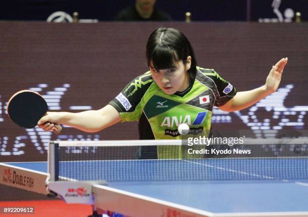 Miu Hirano of Japan plays against Gu Yuting of China in the first round of the women's singles at the table tennis World Tour Grand Finals in Astana,...