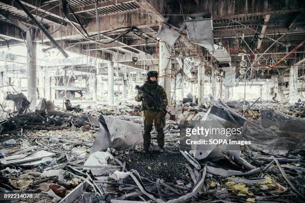 Soldier seen standing with the wreckage at the boarding hall of Donetsk Airport. Sparta battalion is an armed group formed by rebel separatist...