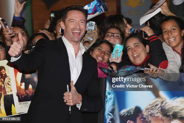 Actor Hugh Jackman signs autographs and takes selfies with fans during "The Greatest Showman" premiere red carpet at Oasis Coyoacan on December 13,...
