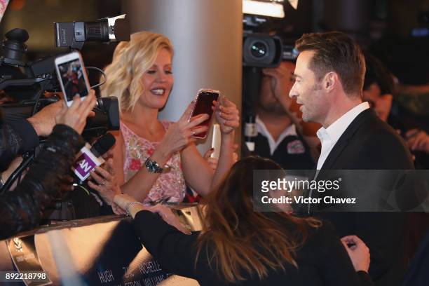 Actor Hugh Jackman speaks with the press during the "The Greatest Showman" premiere red carpet at Oasis Coyoacan on December 13, 2017 in Mexico City,...