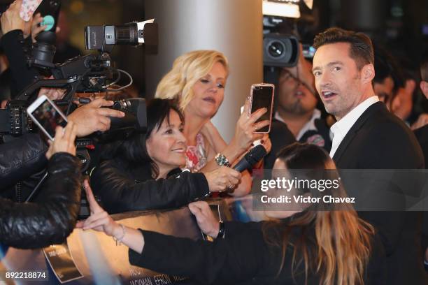 Actor Hugh Jackman speaks with the press during the "The Greatest Showman" premiere red carpet at Oasis Coyoacan on December 13, 2017 in Mexico City,...