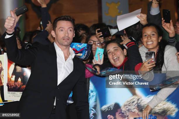 Actor Hugh Jackman signs autographs and takes selfies with fans during "The Greatest Showman" premiere red carpet at Oasis Coyoacan on December 13,...