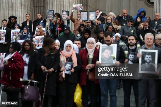 Mourners leave after attending the Grenfell Tower National Memorial Service at St Paul's Cathedral in London on December 14 to mark the six month...