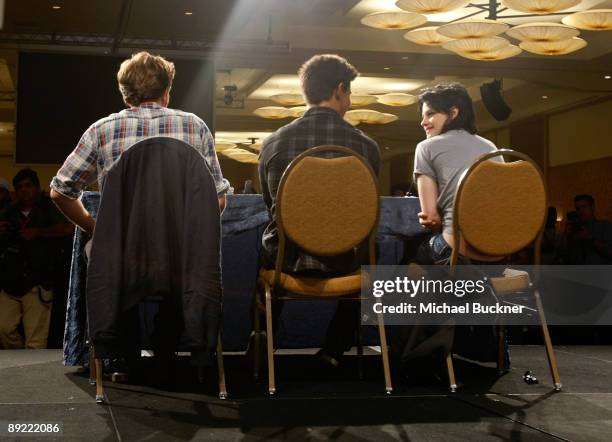 Actors Robert Pattinson, Taylor Lautner and Kristen Stewart speak onstage during "The Twilight Saga: New Moon" Summit Entertainment panel during...