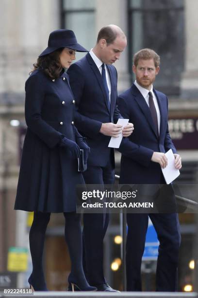 Britain's Catherine, Duchess of Cambridge, Britain's Prince William, Duke of Cambridge and Britain's Prince Harry leave after attending the Grenfell...