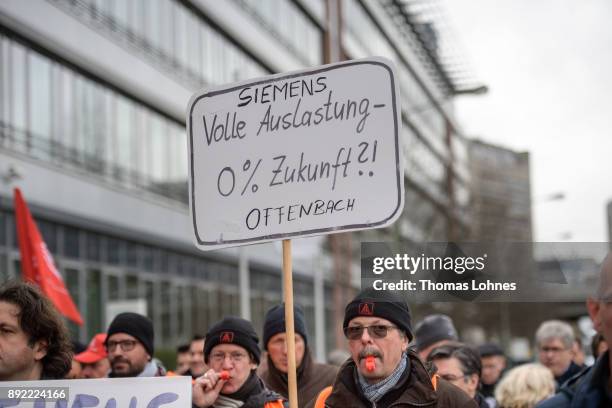 Employees of German engineering giant Siemens protest against the planned closure of a local facility on December 14, 2017 in Offenbach, Germany....