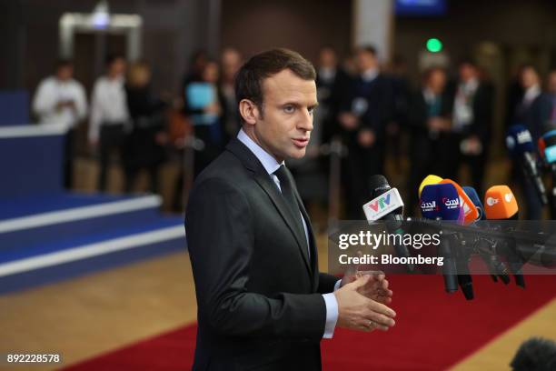 Emmanuel Macron, France's president, speaks to journalists as he arrives at a European Union leaders summit at the Europa Building in Brussels,...