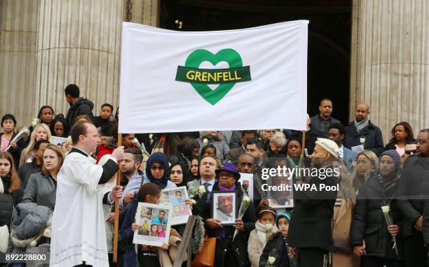 People gather on the steps after the Grenfell Tower National Memorial Service held at St Paul's Cathedral on December 14, 2017 in London, England....