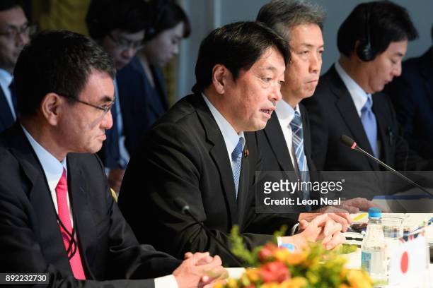 Japan's Foreign Minister Taro Kono and Japanese Defence Minister Itsunori Onodera speak at the head of a meeting on December 14, 2017 in London,...