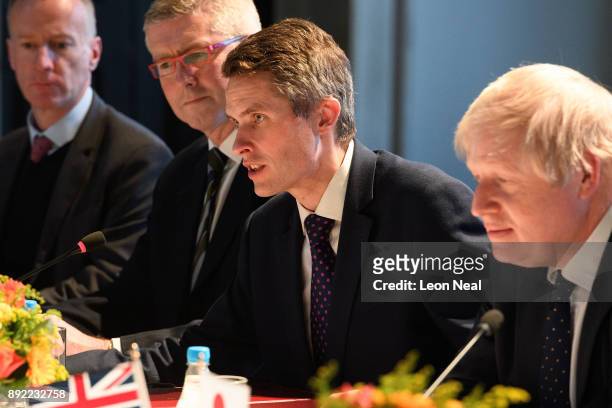 Defence Secretary Gavin Williamson and Britain's Foreign Secretary Boris Johnson speak at the head of a meeting in the Queen's House gallery on...