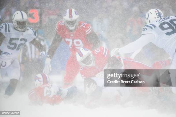 LeSean McCoy of the Buffalo Bills is brought down by members of the Indianapolis Colts during the third quarter at New Era Field on December 10, 2017...