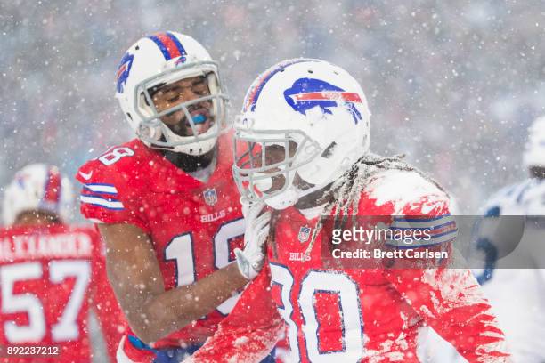 Lafayette Pitts of the Buffalo Bills is congratulated by Andre Holmes after a defensive stop on a special teams play against the Indianapolis Colts...