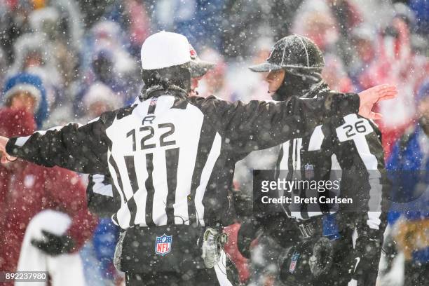 Referees discuss a Indianapolis Colts two point conversion attempt that was called back due to penalty during the fourth quarter against the Buffalo...