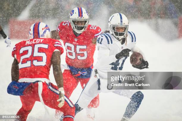 Matthias Farley of the Indianapolis Colts runs with an intercepted pass intended for Charles Clay of the Buffalo Bills during the fourth quarter at...