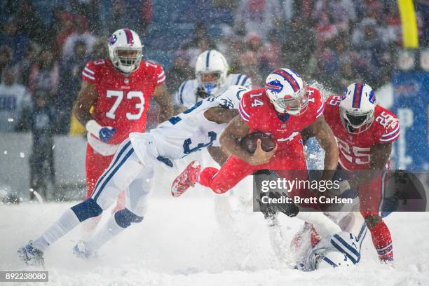 Joe Webb of the Buffalo Bills is tackled by T.J. Green and Matthias Farley of the Indianapolis Colts after reaching a first down in overtime at New...