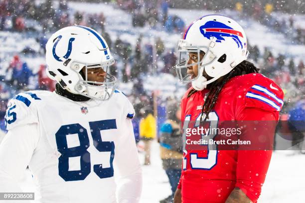 Brandon Williams of the Indianapolis Colts speaks with Kelvin Benjamin of the Buffalo Bills after the game at New Era Field on December 10, 2017 in...
