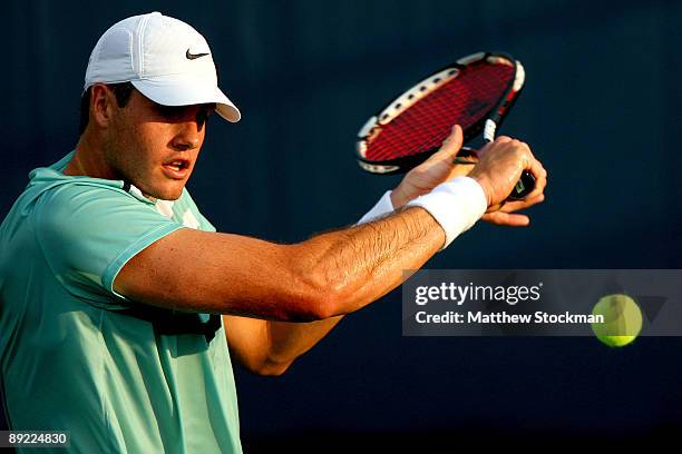 John Isner returns a shot to Denis Istomin of Uzebekistan during the Indianapolis Tennis Championships on July 23, 2009 at the Indianapolis Tennis...