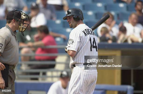 First baseman Paul Konerko of the Chicago White Sox has words with home plate umpire Dan Iassogna after striking out in the ninth inning against the...