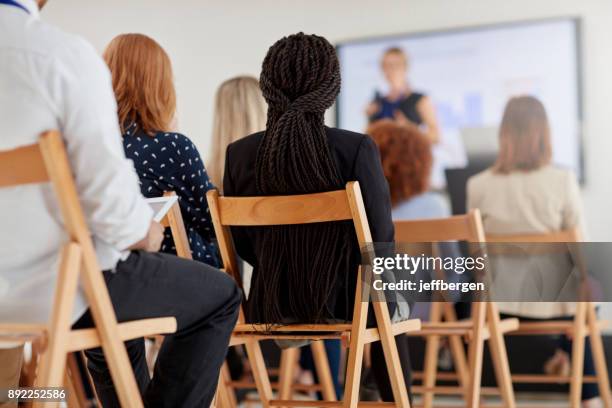 business conference in session - attending presentation stock pictures, royalty-free photos & images