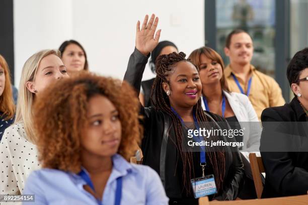 actively participating in the conference - participant stock pictures, royalty-free photos & images