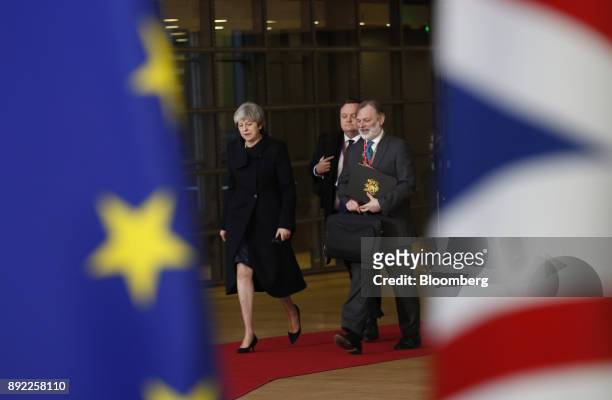 Theresa May, U.K. Prime minister, left, and Tim Barrow, U.K. Permanent representative to the European Union , right, arrive at a European Union...