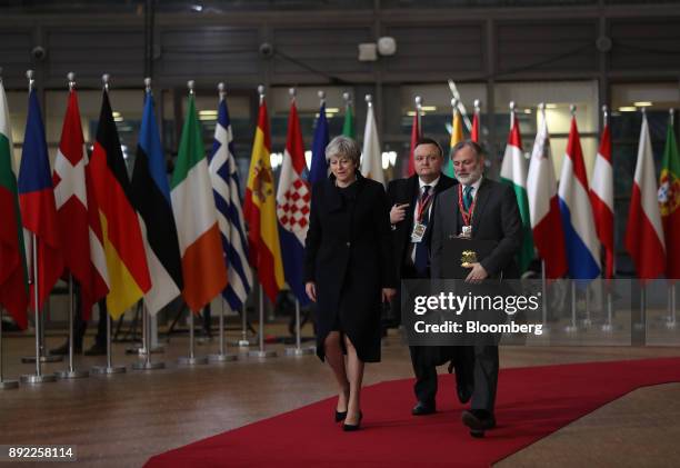 Theresa May, U.K. Prime minister, left, and Tim Barrow, U.K. Permanent representative to the European Union , right, arrive at a European Union...