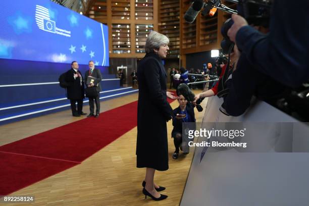 Theresa May, U.K. Prime minister, speaks to journalists as she arrives at a European Union leaders summit at the Europa Building in Brussels,...