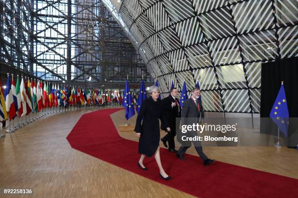 Theresa May, U.K. Prime minister, left, and Tim Barrow, U.K. Permanent representative to the European Union , right, arrive at a European Union...