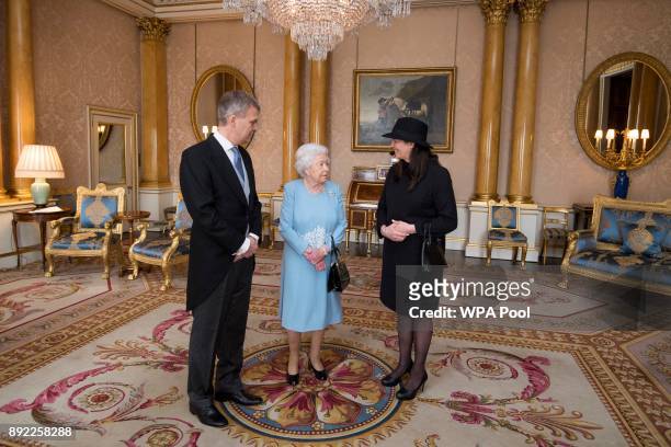 Queen Elizabeth II meets Mr Stefan Haukur Johannesson, the Ambassador of Iceland, and Mrs Halldora Hermannsdottir during a private audience at...