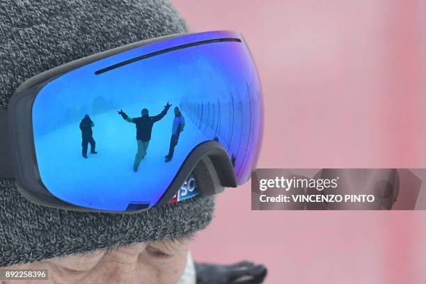 People are reflected on ski goggles during a training for the FIS Alpine World Cup Men Downhill on December 14, 2017 in Val Gardena, Italian Alps. /...