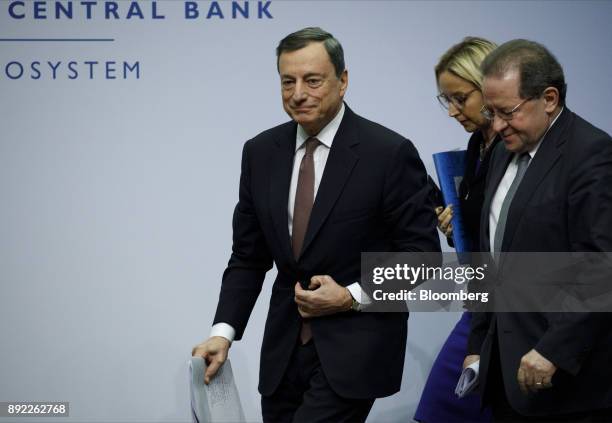 Mario Draghi, president of the European Central Bank , left, Christine Graeff, director general for communications at the European Central Bank ,...