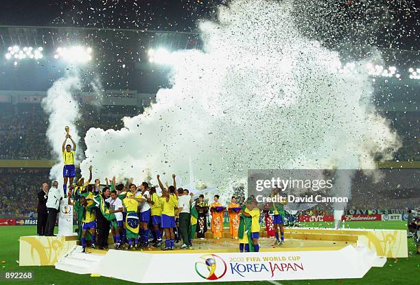 Brazil celebrate as captain Cafu lifts the trophy after the Germany v Brazil, World Cup Final match played at the International Stadium Yokohama in...