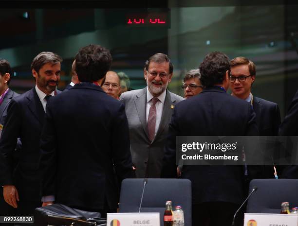 Mariano Rajoy, Spain's prime minister, center, arrives for a roundtable meeting at a European Union leaders summit at the Europa Building in...