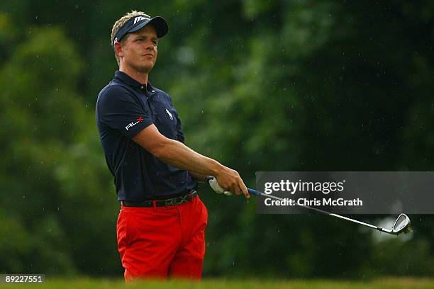 Luke Donald of England watches his second shot on the tenth hole during round one of the RBC Canadian Open at Glen Abbey Golf Club on July 23, 2009...