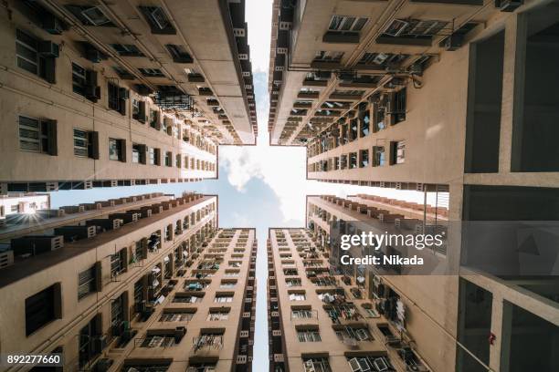 symmetrical residential buildings in hong kong, china - small apartment building exterior stock pictures, royalty-free photos & images