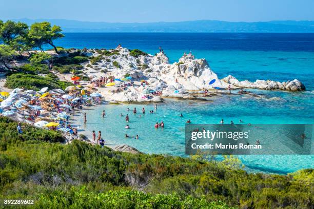 beautiful orange beach on the east coast of sithonia peninsula, halkidiki, aegean sea, greece. - macedonia greece stock pictures, royalty-free photos & images