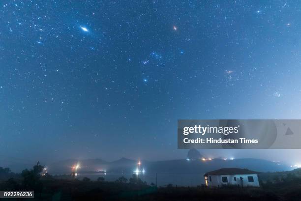 Geminid meteor shower seen from Pawna lake near Lonavala on December 14, 2017 in Mumbai, India. Stargazers across the globe braved the winter chill...