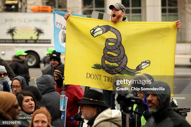 Demonstrators rally outside the Federal Communication Commission building to protest against the end of net neutrality rules December 14, 2017 in...